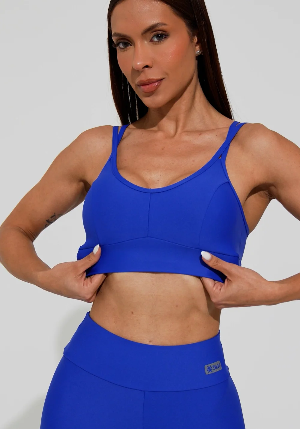 Top fitness feminino azul com recorte e alça dupla action dlk