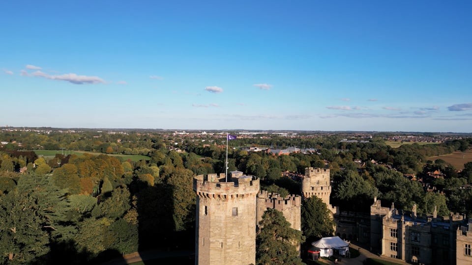 Aerial view of Warwick Castle surrounded by trees and countryside, photographed during the Institute of Leadership’s annual Members’ Reception.