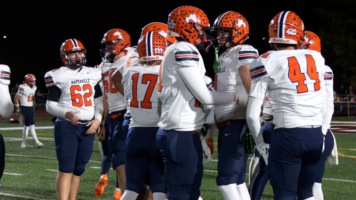NEIGHBORHOOD END   Football → Naperville North football wins a thrilling 21-15 crosstown classic