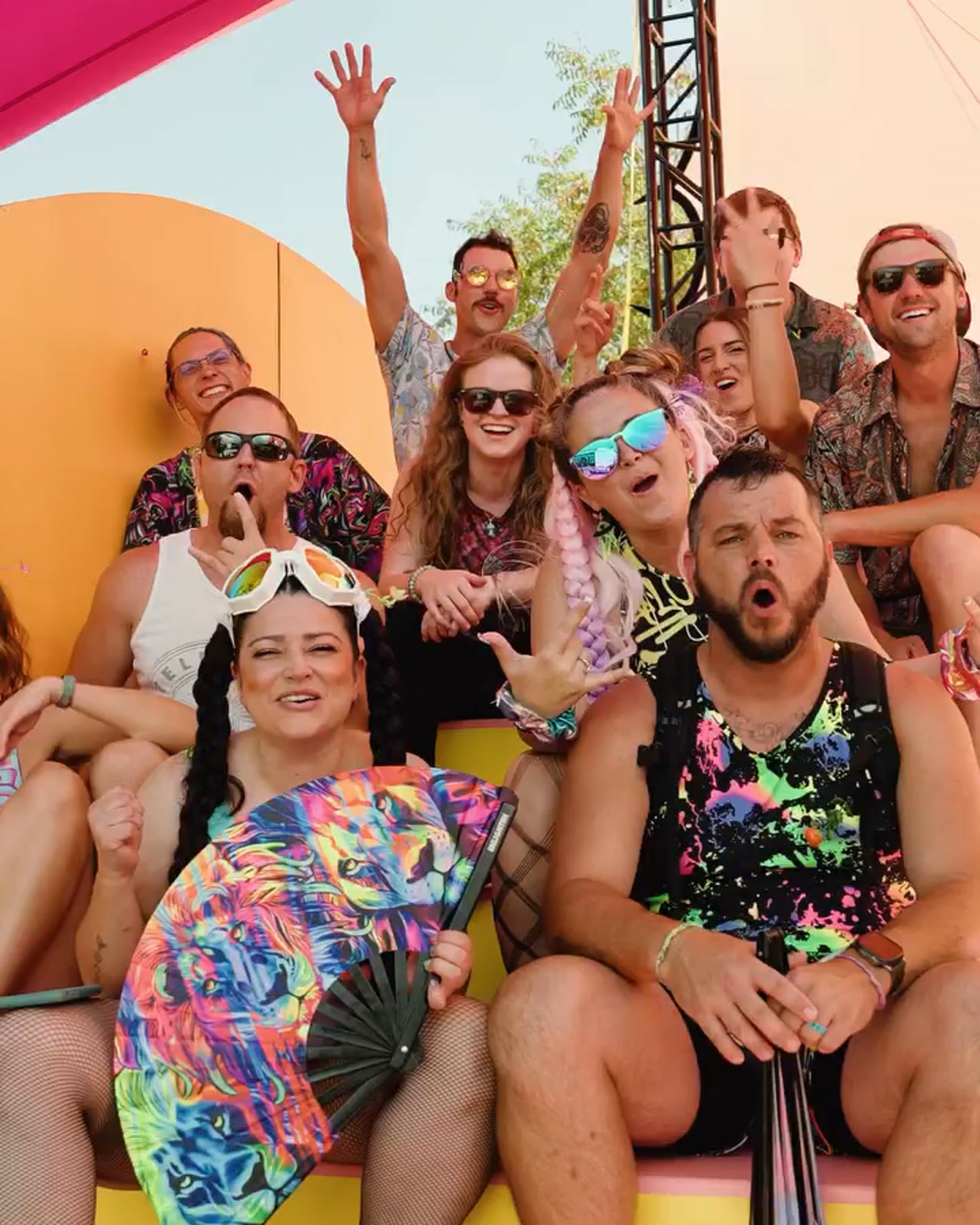 Festival-goers celebrating on the structure
