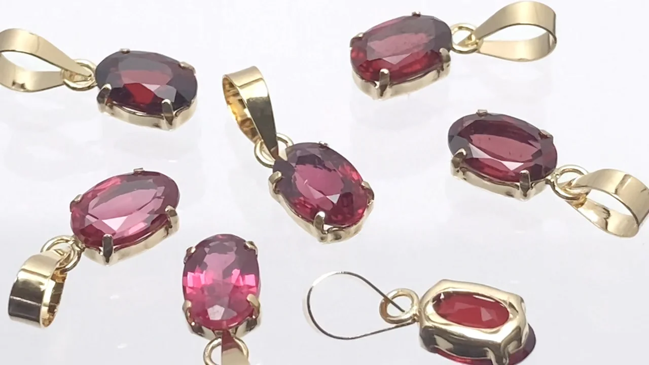 レッドスピネル オーバルファセットカット6×4mm ペンダントトップ