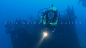 0221_female scuba diver and ship wreck