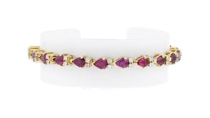 C. 1990 Vintage 8.80 ct. t.w. Ruby and 1.10 ct. t.w. Diamond Bracelet in 14kt Yellow Gold