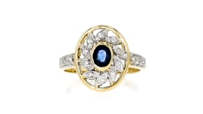C. 1980 Vintage .30 Carat Sapphire Ring with .16 ct. t.w. Diamonds in 14kt Yellow Gold