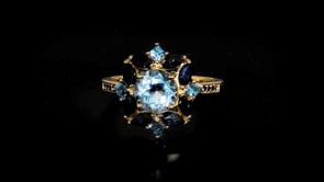 1.50 Carat Sky Blue Topaz and 1.06 ct. t.w. Sapphire Ring in 18kt Gold Over Sterling