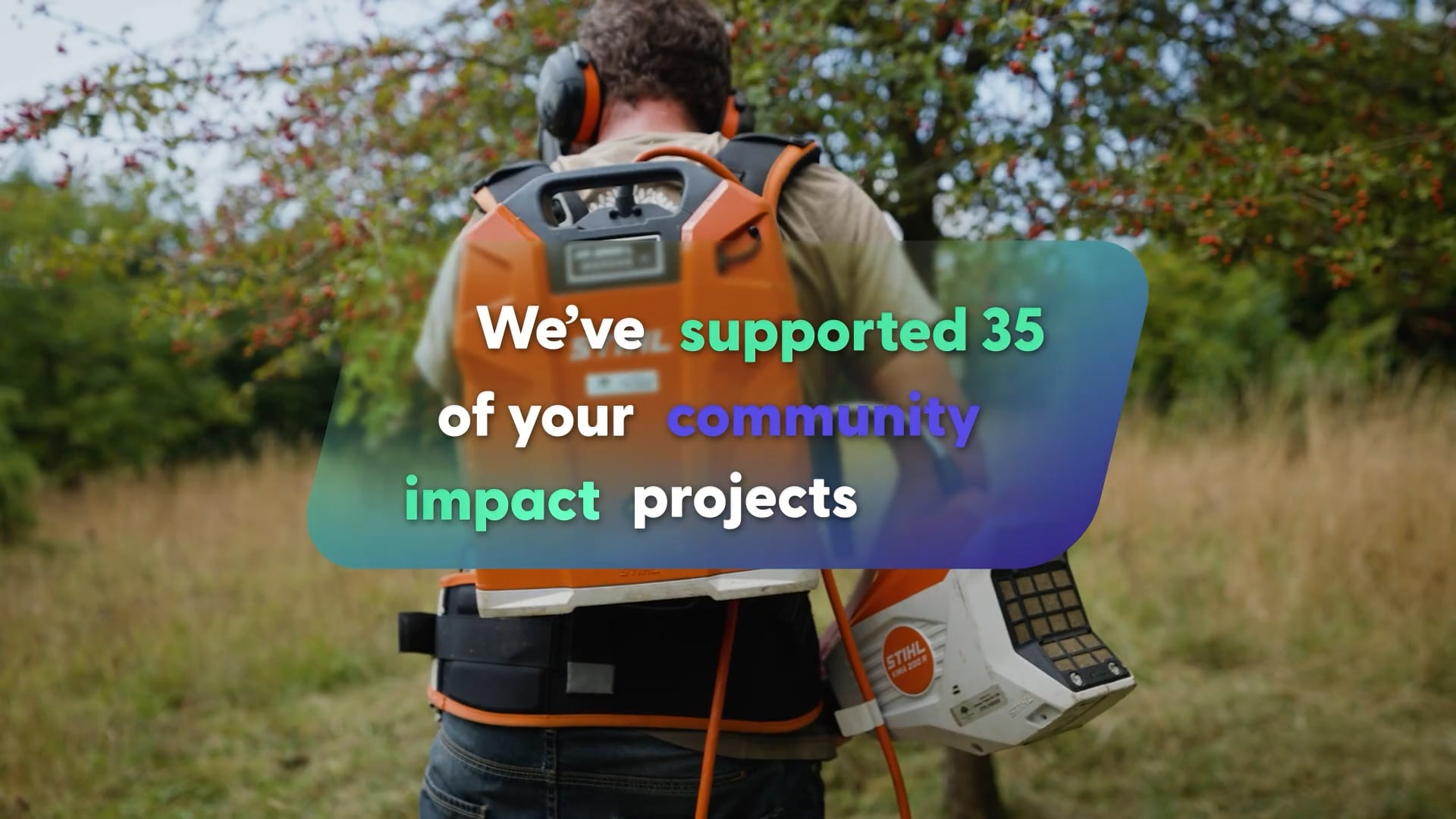 A person with an electric strimmer looking after land with the text: We've supported 35 of your community impact projects.