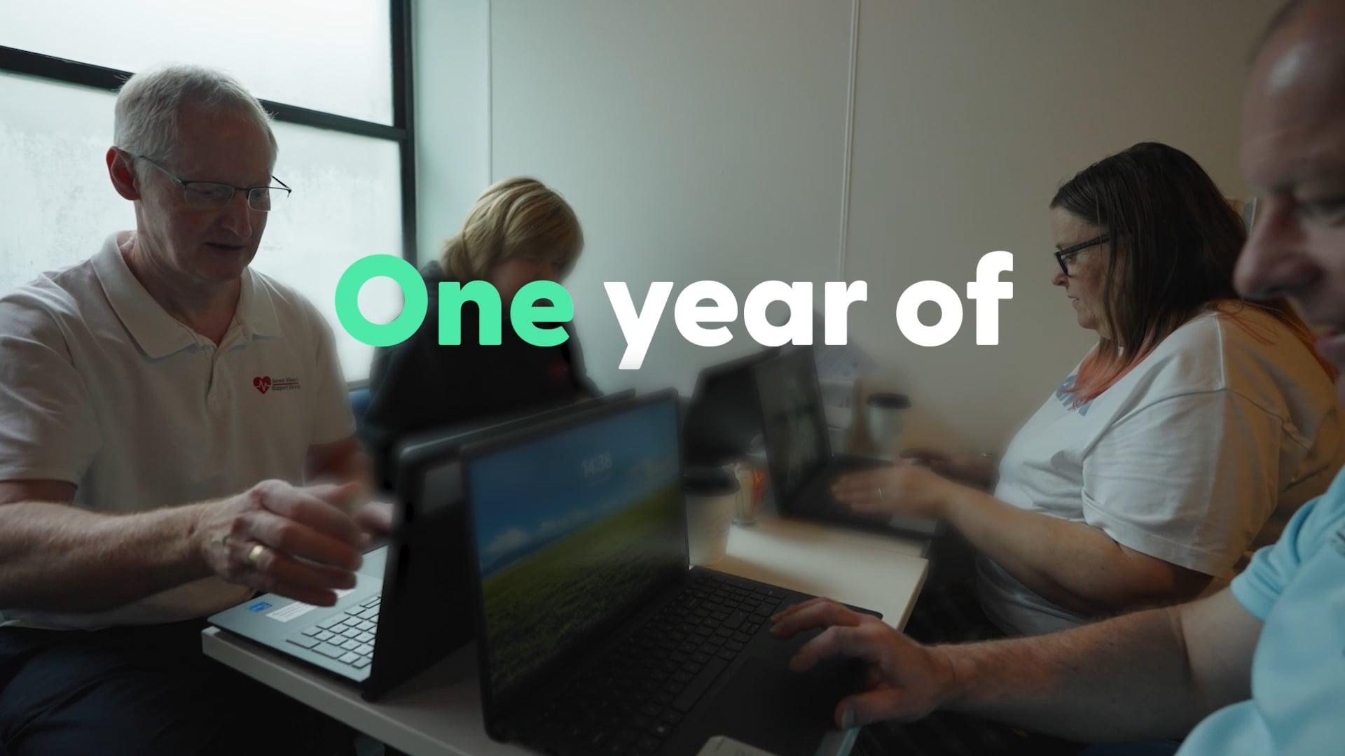 A lady is teaching in front of a group of support workers teaching them Makaton Signing.