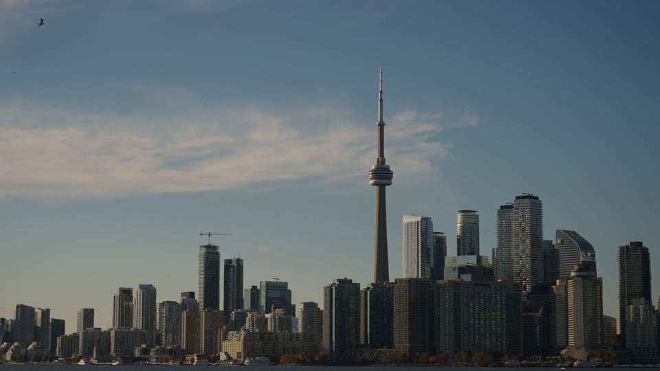 Toronto skyline and CN Tower across the harbour from Toronto Island, a still from a Happy Soul Films e-shoot