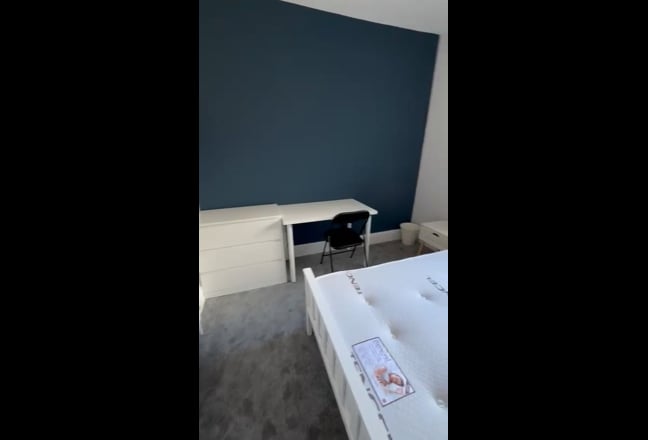 Video 1: Spacious and modern shared living room with seating area