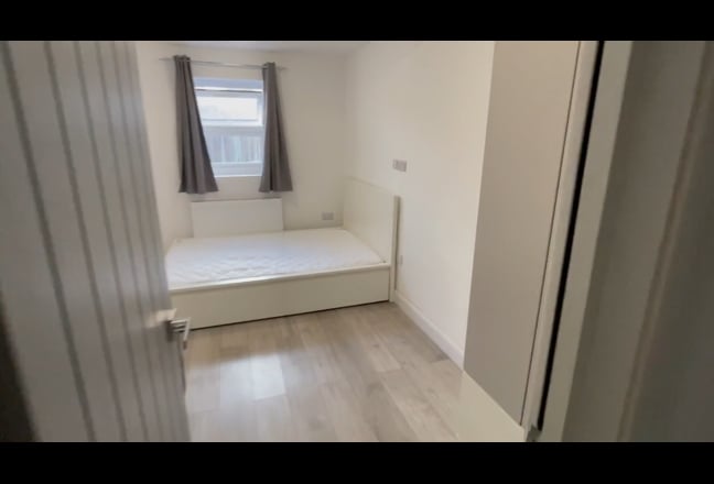 A bright, spacious studio-style room with its own  Main Photo