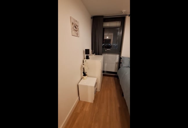 Modern double bedroom with a separate bathroom.  Main Photo