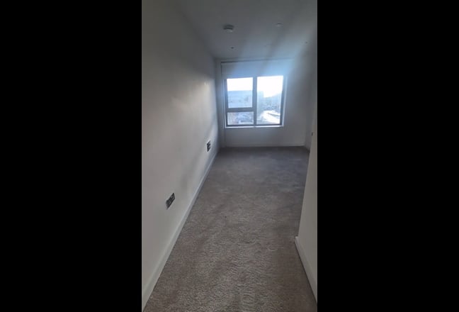 A large room in a modern built Main Photo