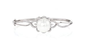 C. 1990 Vintage 13mm Cultured Pearl and .65 ct. t.w. Diamond Bangle Bracelet in 18kt White Gold