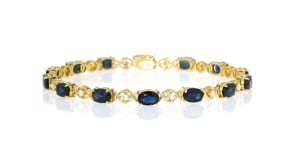 C. 1990 Vintage 7.70 ct. t.w. Sapphire and .40 ct. t.w. Diamond Bracelet in 18kt Yellow Gold