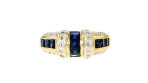 C. 1980 Vintage 1.20 ct. t.w. Sapphire and .13 ct. t.w. Diamond Ring in 14kt Yellow Gold