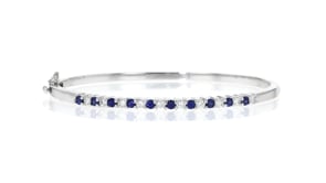 C. 1990 Vintage .70 ct. t.w. Sapphire and .50 ct. t.w. Diamond Bangle Bracelet in 14kt White Gold