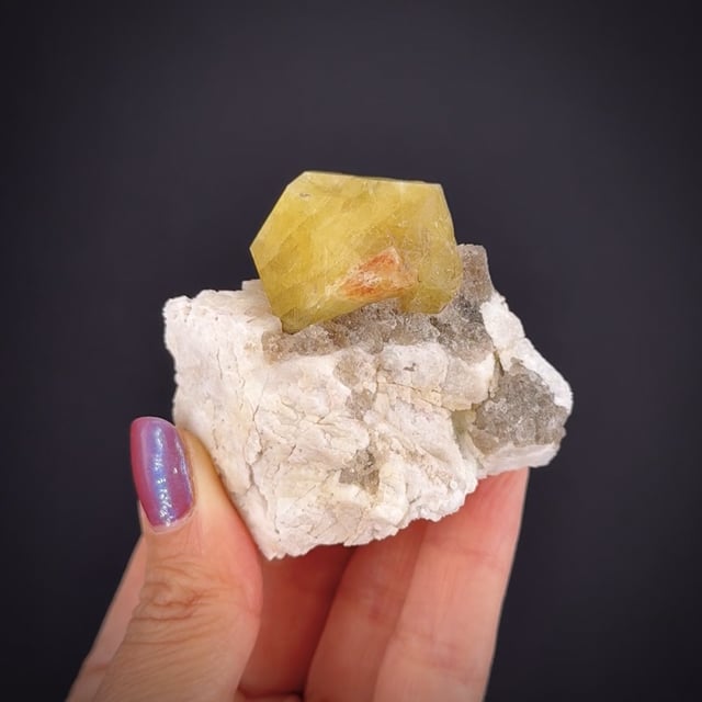 Londonite on Feldspar