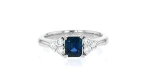 C. 1990 Vintage .73 Carat Emerald and .34 ct. t.w. Diamond Ring in Platinum