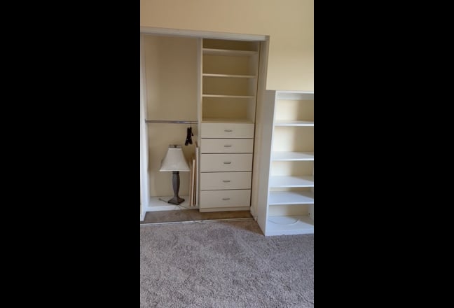 Large room with custom cupboards and closet  Main Photo