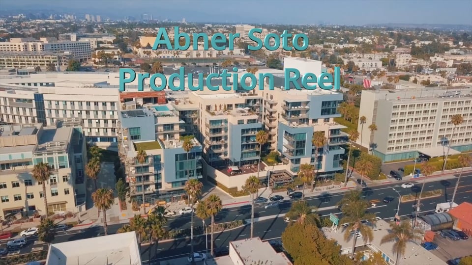 Aerial view of coastal buildings with Abner Soto Production Reel title text