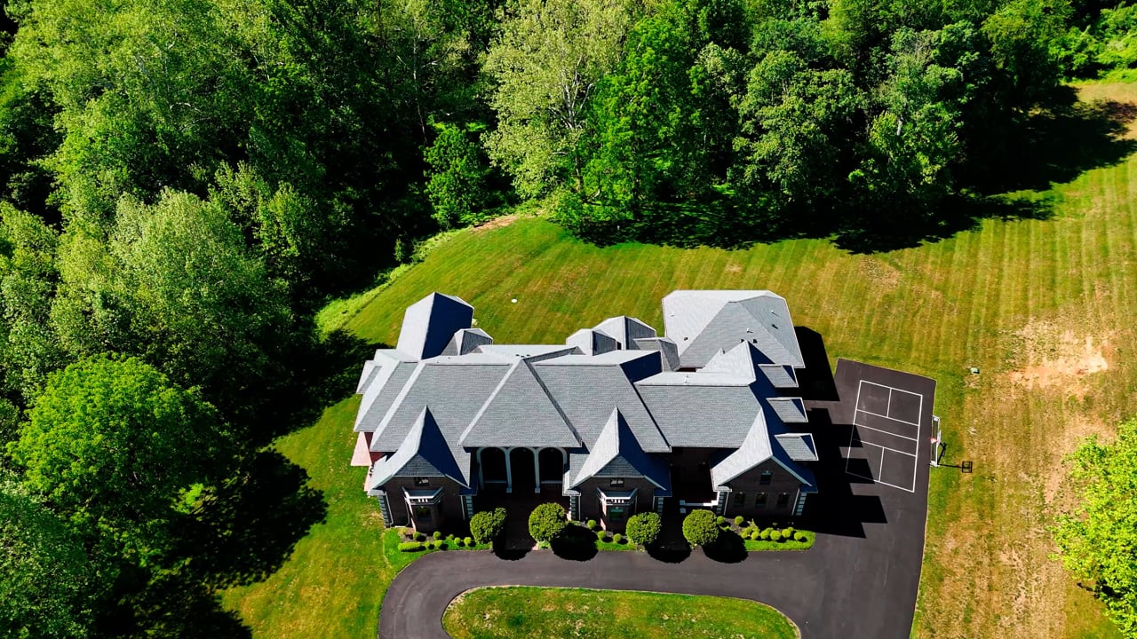Aerial drone walkthrough of a completed Supreme Restorations Maryland residential roof replacement