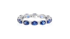 2.50 ct. t.w. Sapphire Eternity Band with .12 ct. t.w. Diamonds in 14kt White Gold