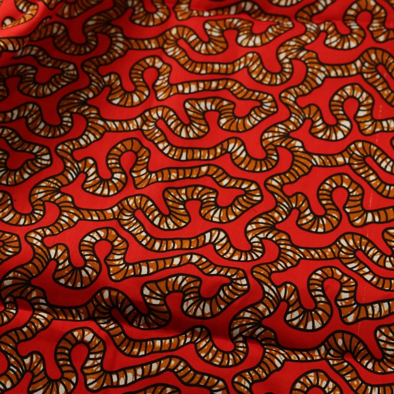 Vidéo: Tissu Wax 100% coton – Motif serpentin rouge (coupon de 2,70 mètres)