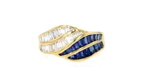 C. 1990 Vintage 1.22 ct. t.w. Sapphire and .87 ct. t.w. Diamond Wave Ring in 18kt Yellow Gold