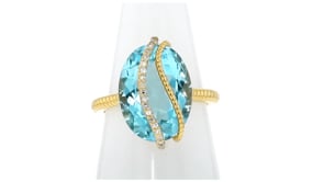 11.00 Carat Sky Blue Topaz Ring with .10 ct. t.w. Diamonds in 18kt Gold Over Sterling