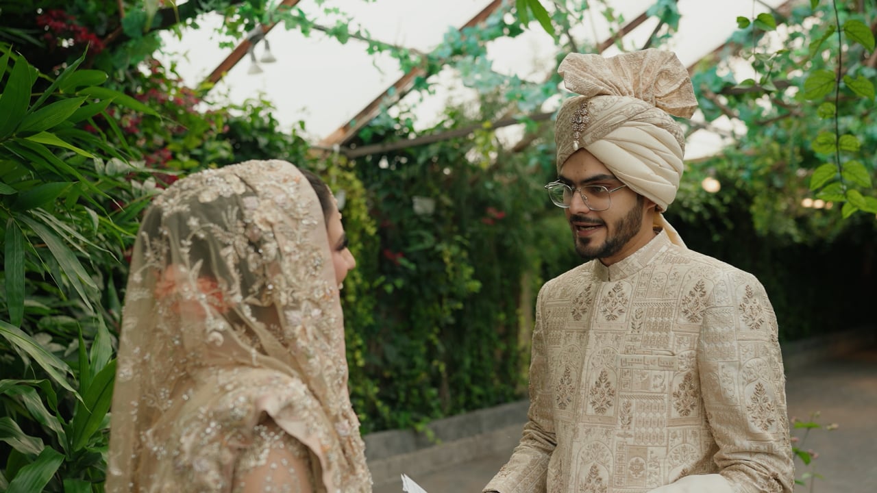 A bride and groom face to face in a garden &mdash; still from Aina & Yaseen&rsquo;s Nikaah highlights by Happy Soul Films