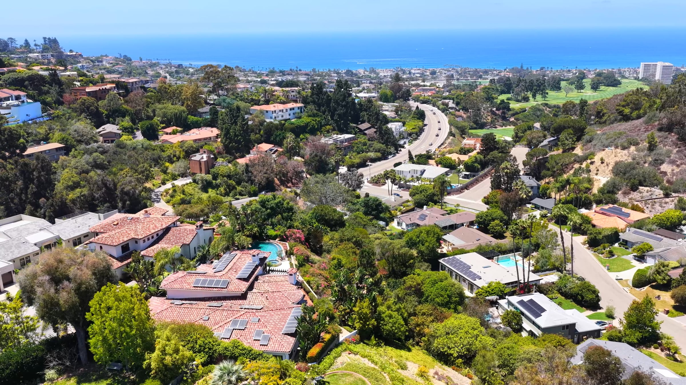 Still from the 1678 Marisma Way listing film: a La Jolla home at dusk