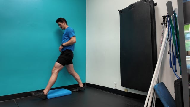 Half kneeling T rotation against wall