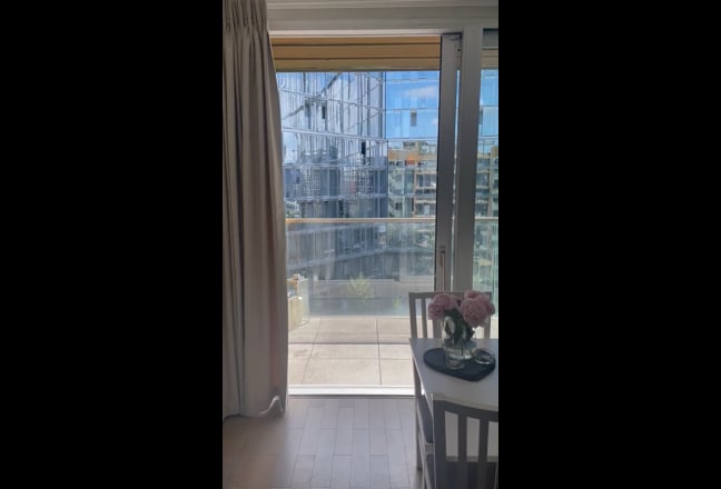 Video 1: Bedroom  with door to balcony one looking inside Aurora gardens 