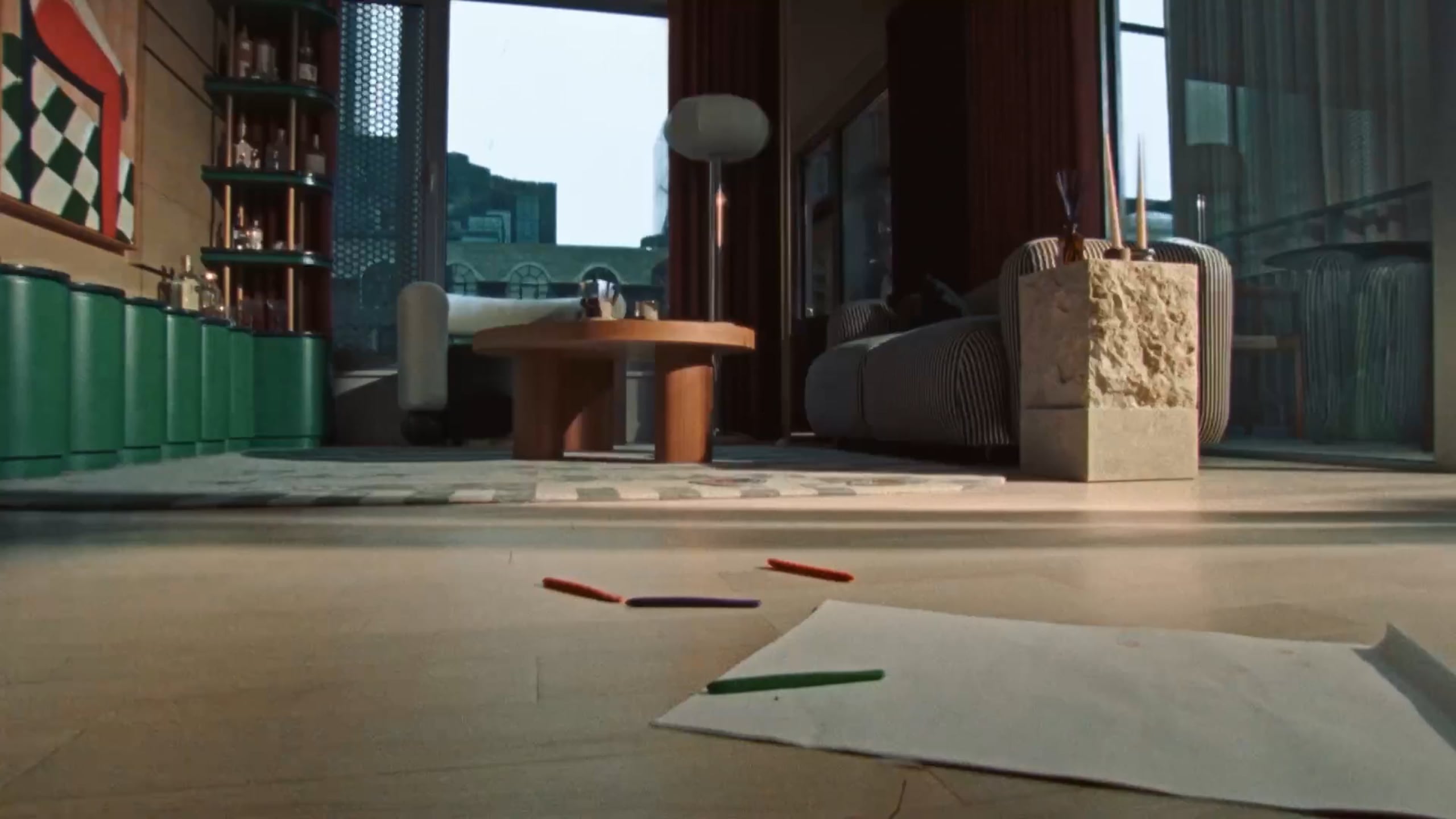 An apartment living room with a round table and city view
