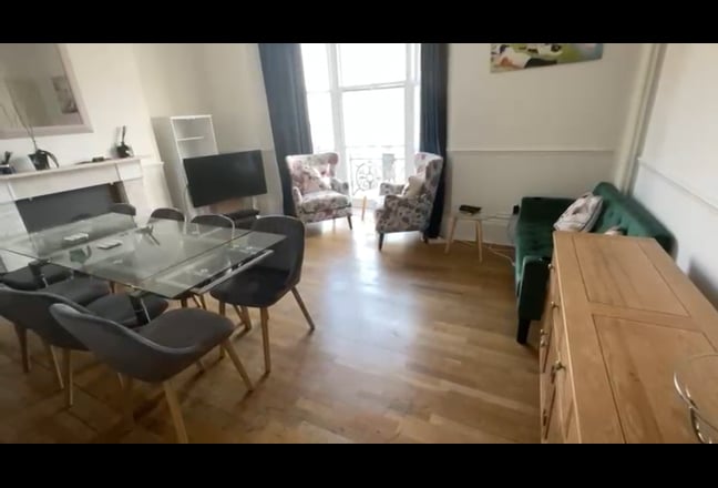 Video 1: Large Living room - High ceilings with full height windows with oblique sea views