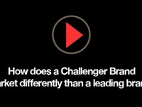 How does Challenger Branding market differently than a leading brand?