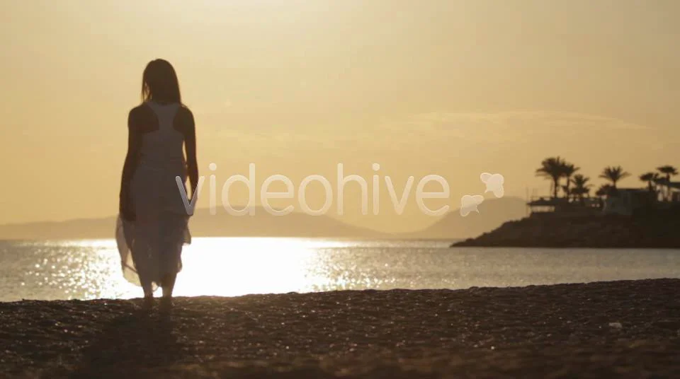 Woman Walking On Beach on Vimeo
