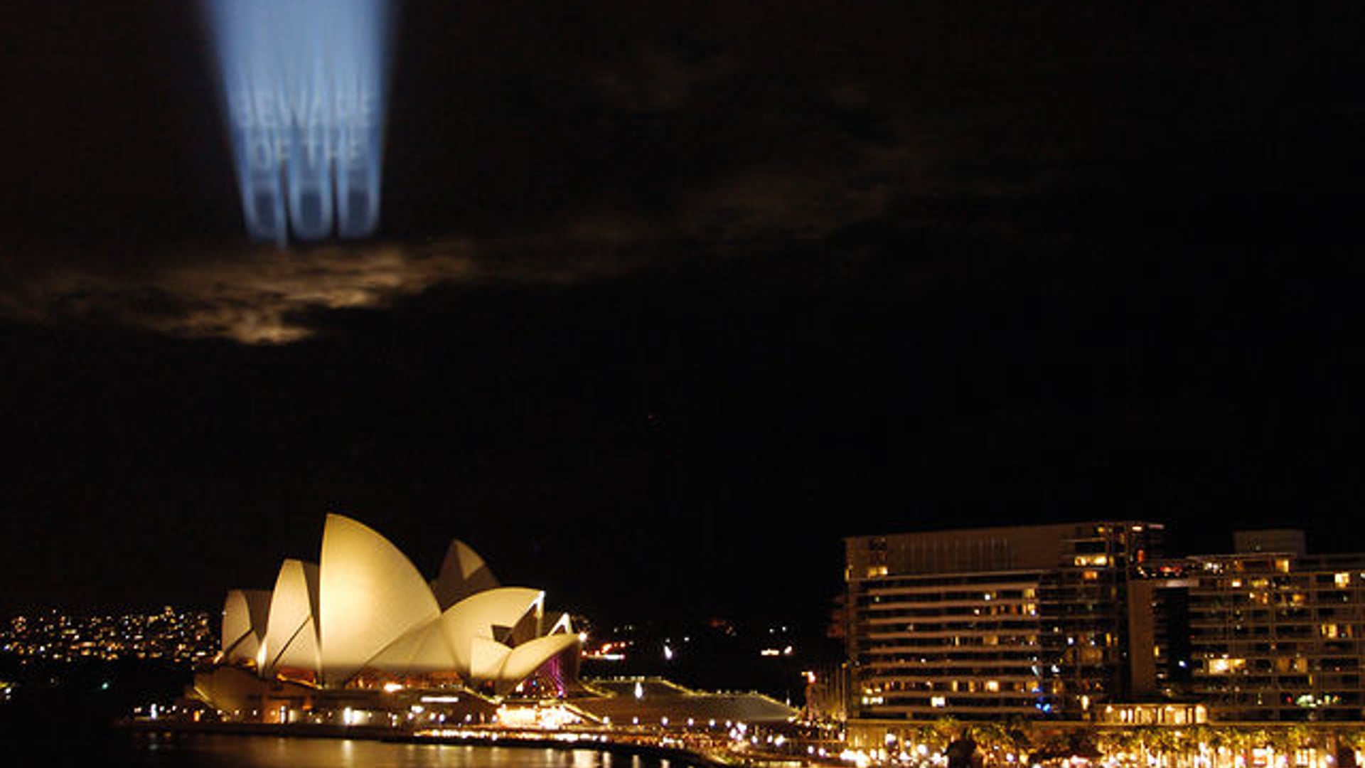 BEWARE OF THE GOD Projection on clouds documentation, Deborah Kelly artwork