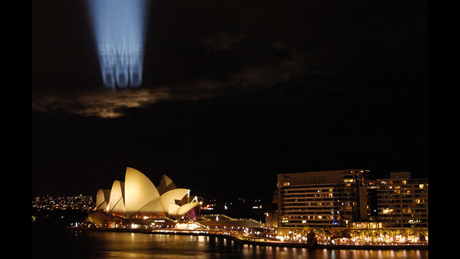 BEWARE OF THE GOD Projection on clouds documentation, Deborah Kelly artwork