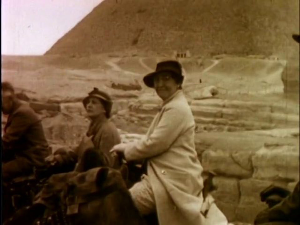 woman riding camel near the pyramids - 1935