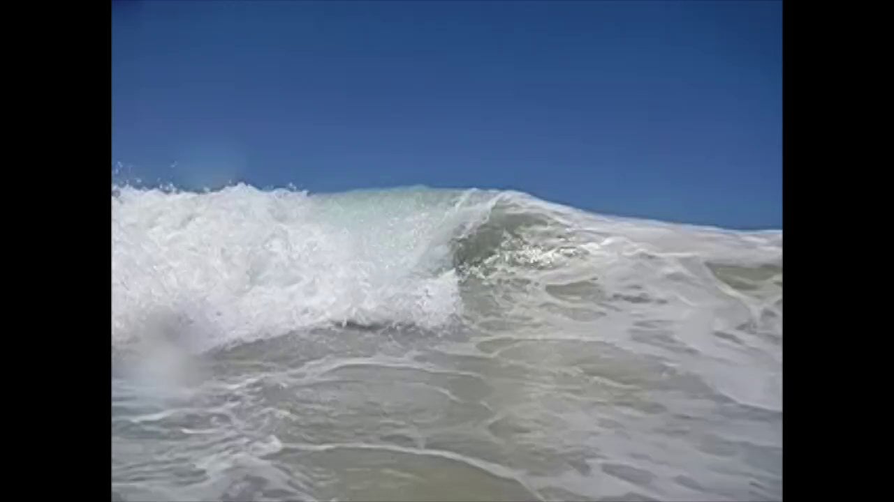 Slow Motion Surfing Wave Stealing the Camera on Vimeo