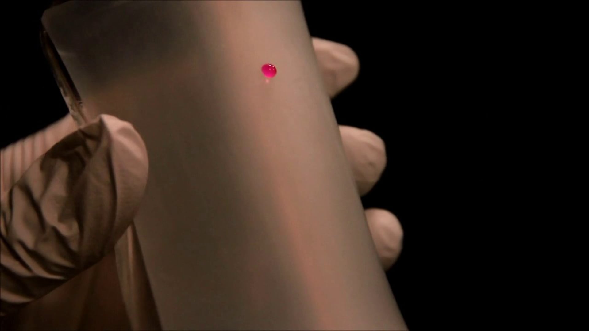Tunable Material -- Mobility control of water drops by bending the membrane