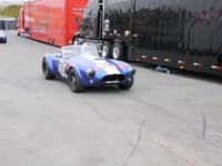 Monterey Motorsports Reunion 2011-1960’s AC Cobras, Mustangs, Corvettes, Porsches, and a few misc. cars exiting the track after morning qualifying laps at Laguna Seca.