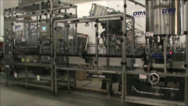 DTM Packaging Purefil 2000 Filler Filling Children's Cough Syrup at 200 BPM