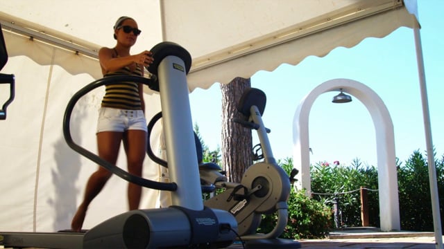 A Woman Jogs on a Treadmill