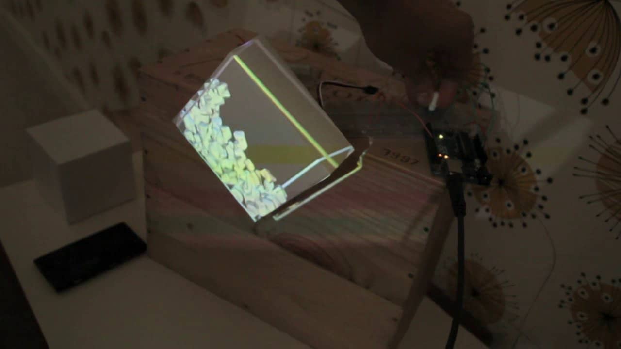 Virtual rocks colliding with an interactive cardboard box on Vimeo