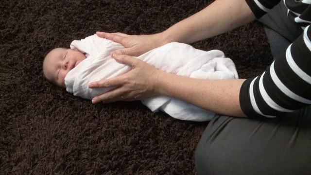 Swaddle hands to online face