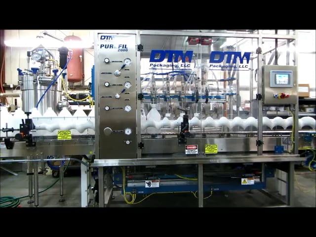 DTM Purefil 2000 Walking Beam Filler - Filling Gallon-sized Containers