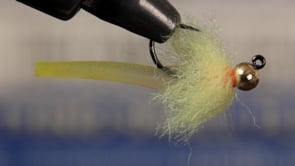A fly vise holding a undefined after it is tied