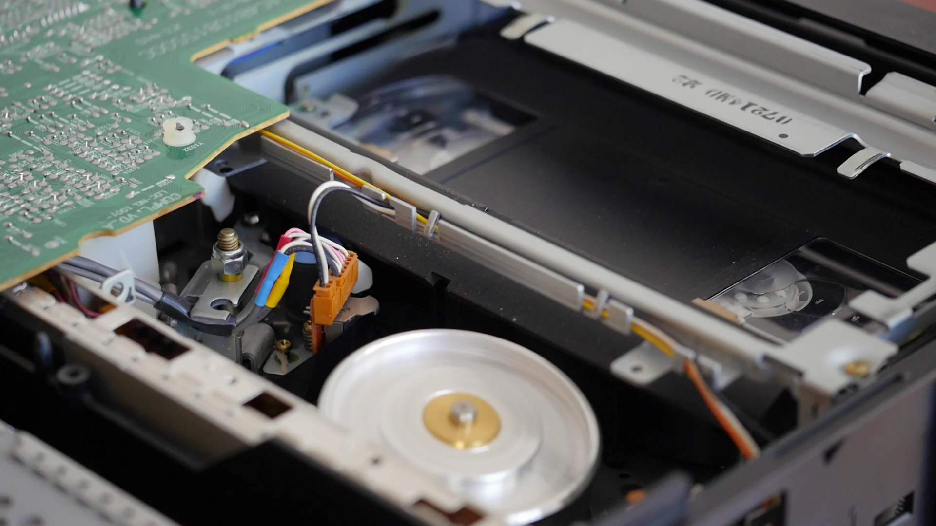 TV, DVD and video player repairs' office testing disassembled VHS